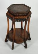 ORIENTAL CARVED WOOD URN STAND, the hexagonal top with four carved stylised leaves to the corners
