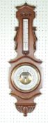 CURRY AND PAXTON, LATE NINETEENTH CENTURY CARVED OAK CASED ANEROID BAROMETER AND THERMOMETER, the