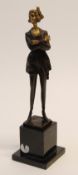 MODERN ART DECO STYLE BRONZE AND GILT BRONZE FEMALE FIGURE, modelled standing with arms across her