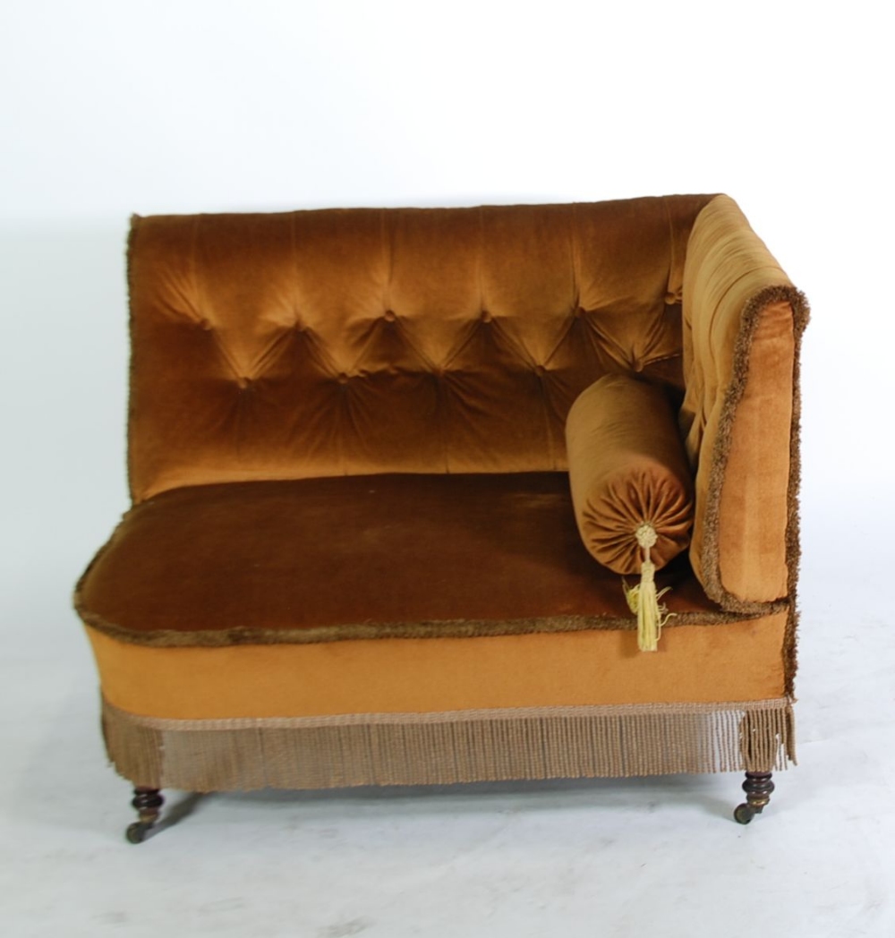 GILLOWS OF LANCASTER CUSTOM MADE ANGLE OR CORNER SETTEE ON MAHOGANY LEGS, the `L` shaped buttoned