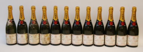 TWELVE BOTTLES OF MOET & CHANDON DRY IMPERIAL CHAMPAGNE, 1970, all with tissue wraps (a/f) and far