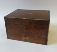 A MID NINETEENTH CENTURY ROSEWOOD TRAVELLING TOILET CASE BY HOWEL & CO., MANUFACTURERS, REGENT ST.,