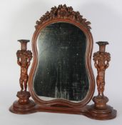 GOOD QUALITY VICTORIAN CARVED WALNUTWOOD TOILET MIRROR, with cherubic candle holders, the mirrored
