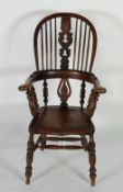 MID NINETEENTH CENTURY ELM HIGH BACK WINDSOR ARMCHAIR, the two part hoop back with pierced splat