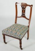 EDWARDIAN MARQUETRY INLAID ROSEWOOD NURSING CHAIR, the floral pierced splat with floral inlaid
