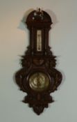 PRILLIEU, REIMS, EARLY 20th CENTURY FRENCH CARVED WALNUT CASED ANEROID BAROMETER, the 5 1/2"" dial