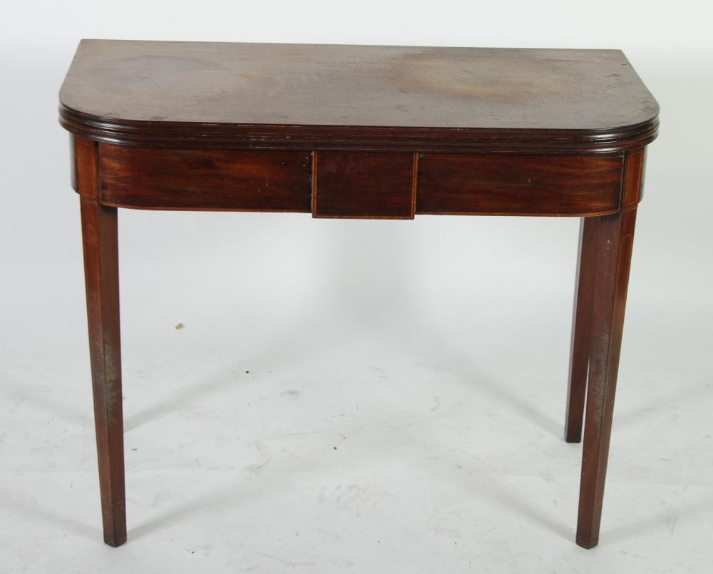 EARLY NINETEENTH LINE INLAID MAHOGANY FOLD OVER TEA TABLE, the rounded oblong top with moulded edge