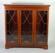 EDWARDIAN MAHOGANY AND SATINWOOD STRUNG DWARF BOOKCASE, the polished moulded oblong top above three