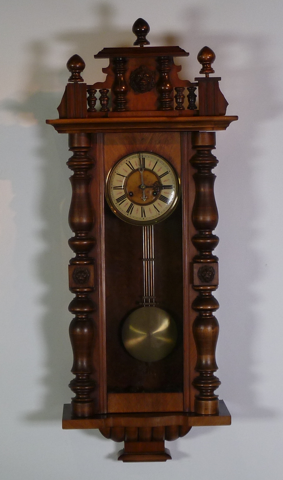 LATE NINETEENTH/EARLY TWENTIETH CENTURY WALNUT AND STAINED BEECH VIENNA STYLE SPRING DRIVEN WALL