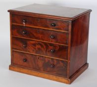 NINETEENTH CENTURY FIGURED MAHOGANY TABLE TOP CHEST OF FOUR GRADUATED LONG DRAWERS, with mahogany