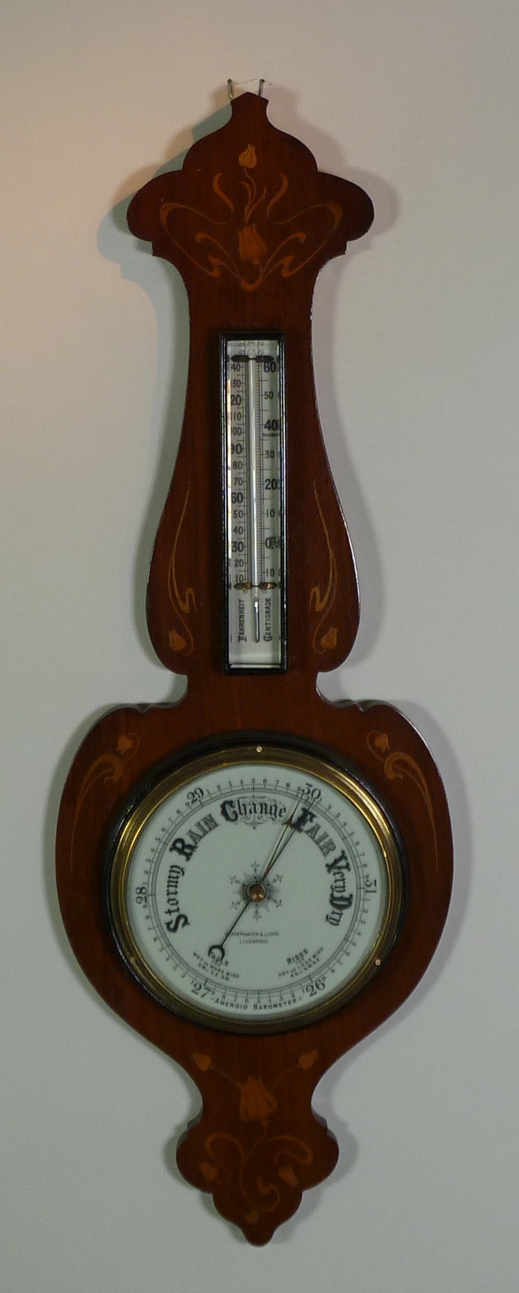ART NOUVEAU MARQUETRY INLAID MAHOGANY ANEROID BAROMETER, signed Schierwater and Lloyd, Liverpool,