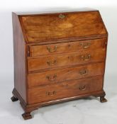 EARLY NINETEENTH CENTURY INLAID MAHOGANY BUREAU, the fall front inlaid with central oval fan and