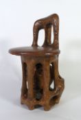 SOL GARSON (B.1923) SCULPTURAL CHAIR OF STAINED CARVED WOOD AND LEATHER ""The Prisoner"" Signed and