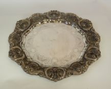 A LARGE PORTUGUESE 833 STANDARD SILVER CIRCULAR TRAY, with elaborate repousse rococo border,