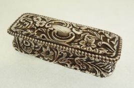 A VICTORIAN SILVER RECTANGULAR PIN BOX, by WILLIAM HARRISON WALTER, with hinged lid, repousse with