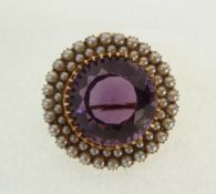 VICTORIAN 15ct GOLD, AMETHYST AND PEARL CIRCULAR BROOCH, the raised centre claw set with a large