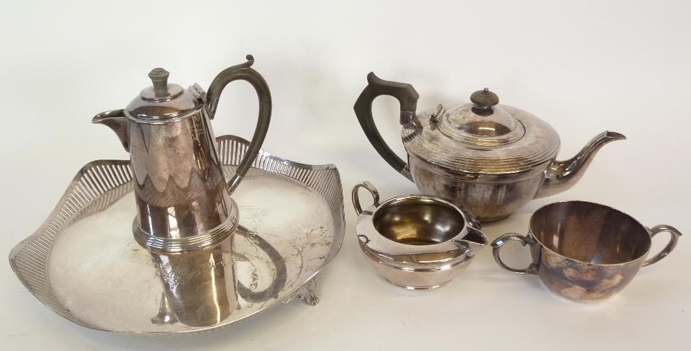 AN ART DECO ELECTROPLATED TEA POT, with reeded cover and angular black wood handle and finial, AN