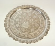 A PERSIAN PLATED CIRCULAR TRAY, engraved with foliate decoration and with shaped edge, 11 ½" (29.