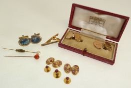 A PAIR OF 18ct GOLD CHASED AND RUBY SET CUFFLINKS, TOGETHER WITH THREE RUBY SET COLLAR STUDS, also a