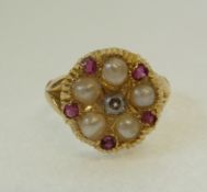 AN 18CT GOLD, PEARL, RUBY AND DIAMOND CLUSTER RING, the circular textured top centre set with a