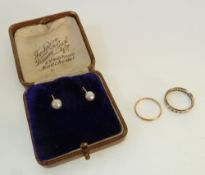 A 9CT GOLD WEDDING RING, Birmingham 1947, AND A STAMPED 9CT GOLD WHITE STONE ETERNITY RING, AND A