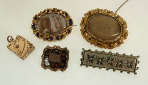 THREE VICTORIAN MOURNING BROOCHES, including A SMALL GOLD AND BLACK ENAMEL SQUARE BROOCH, with c-