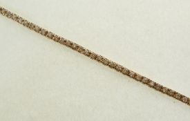 A STAMPED 14CT GOLD AND DIAMOND TENNIS BRACELET, the seventy-one brilliant cut diamonds each