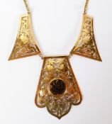 A MID EASTERN TESTED 22CT GOLD NECKLACE formed of three panels, pierced with floriated scrollwork