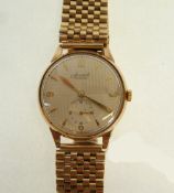 GENT`S ACCURIST 9CT GOLD CASED WRIST WATCH, 21 JEWEL MOVEMENT, silvered part Arabic and baton