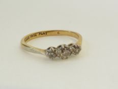 A STAMPED 9CT GOLD AND PLATINUM THREE GRADUATED STONE DIAMOND RING, 0.10ct and smaller, 2.3g