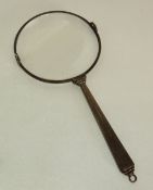 AN ART DECO STERLING SILVER MAGNIFYING GLASS, with fan shaped handle, 5 ½" (14cm) long, 2 ¾" (7cm)