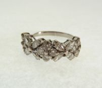 AN 18CT WHITE GOLD AND DIAMOND HALF ETERNITY RING, set with ten small round cut diamonds in three