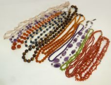 EIGHT HARDSTONE OR GLASS BEAD NECKLACES AND THREE CORAL BEAD NECKLACES