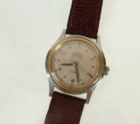 A GENT`S ROAMER, "BREVETE" STAINLESS STEEL CASED WRIST WATCH, 17 jewel movement, with Arabic dial,