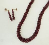 A GARNET BEAD ROPE NELCKACE WITH MATCHING PAIR OF EARRINGS