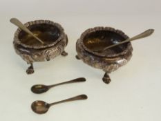 A PAIR OF VICTORIAN SILVER OPEN SALTS, with gadroon borders and repousse with foliate decoration,