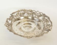 A LATE NINETEENTH CENTURY ELECTROPLATED SWING HANDLE PEDESTAL FRUIT BASKET, with pierced fruiting