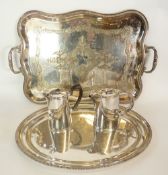 AN ELECTROPLATED TWO HANDLED TRAY, shaped edge, gadroon border and acanthus leaf handles, with