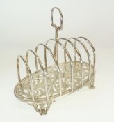 VICTORIAN SILVER SIX DIVISION TOAST RACK, BY WILLIAM HUTTON & SONS, raised on shell capped feet,