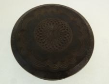 A 19TH CENTURY CICULAR TWIST OPEN DARK WOOD SNUFF BOX, the lid with turned floral decoration,