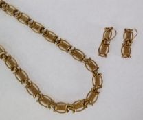 A 9CT GOLD FANCY LINK CHAIN NECKLET, with pierced and textured bar links, AND A PAIR OF MATCHING 9CT