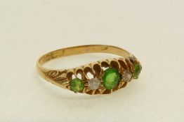 AN 18CT GOLD RING, with lozenge shaped top set with green and white paste, Birmingham 1906, 2.5g
