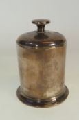 A SILVER CYLINDRIAL CIGARETTE DISPENCER, the domed lid pulling up to reveal a four division