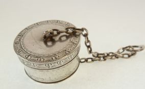 A SMALL SILVER DRUM SHAPED PILL BOX, with engraved border, THE TWO PARTS SECURED BY A SILVER