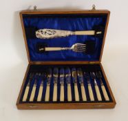 BOXED SET OF SIX PAIRS OF FISH EATERS AND MATCHING SERVERS, WITH PIECED BLADE and foliate scroll