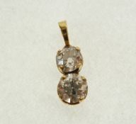 A TESTED 18ct GOLD (unmarked) TWO STONE DIAMOND SET PENDANT, approx 1.75 ct in total