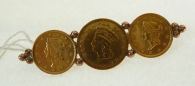 A THREE GOLD GRADUATED AMERICAN DOLLAR COIN BAR BROOCH, coins dated 1852, 1853 and 1856, soldered