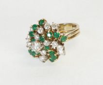 14K GOLD, DIAMOND AND EMERALD DOMED CLUSTER RING set is a whorl pattern with seventeen diamonds