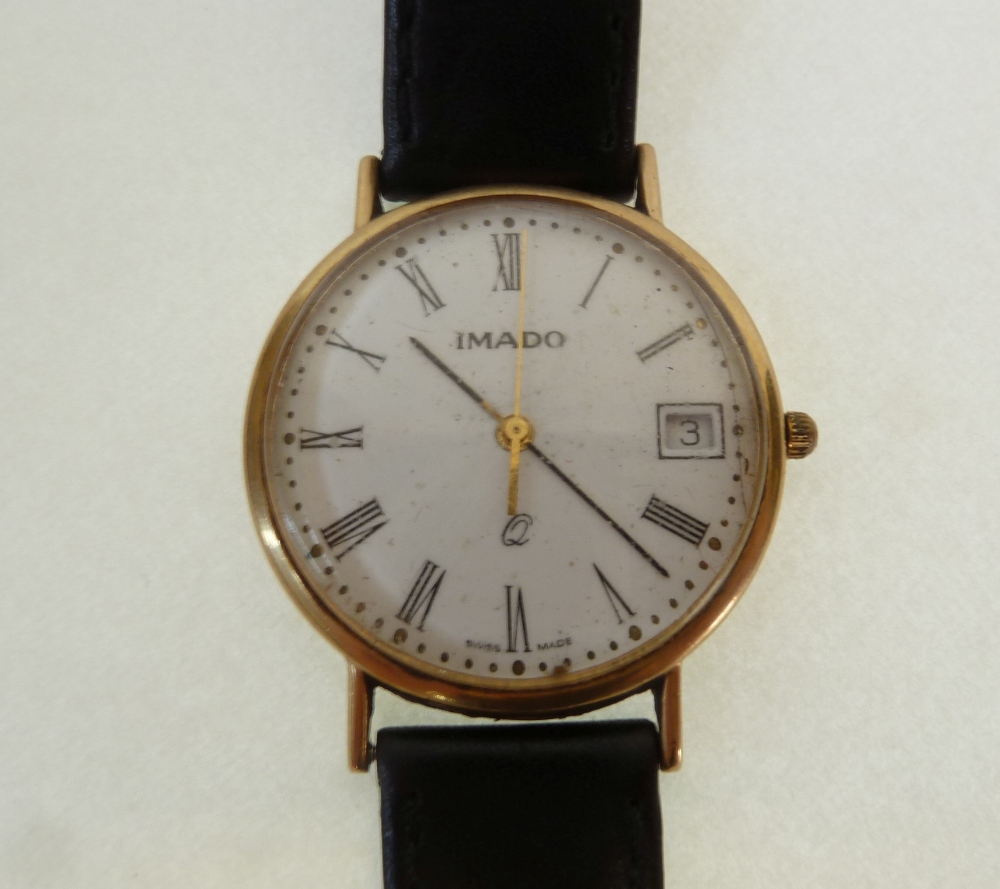 A GENT`S IMADO 9CT GOLD CASED CALANDER WRIST WATCH, battery powered movement, with roman dial, on