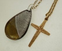 A 9CT TEXTURED GOLD CROSS PENDANT, Birmingham 1972, on gilt metal chain necklace, AND A 9CT GOLD